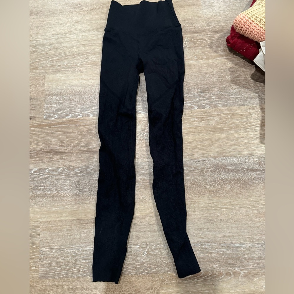 Black Fabletics leggings with see through detail on legs